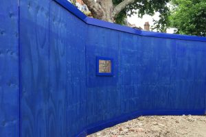 Wooden commercial fencing painted blue