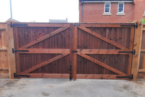 Dark wood gate for residential property