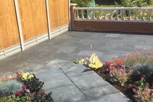 Hard landscaping with flower bed example