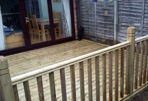 Wooden decking leading on to Bi-folding doors