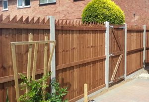 Wooden fencing with concrete supports