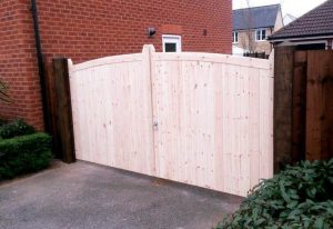 Pale wooden driveway gate on a residential property